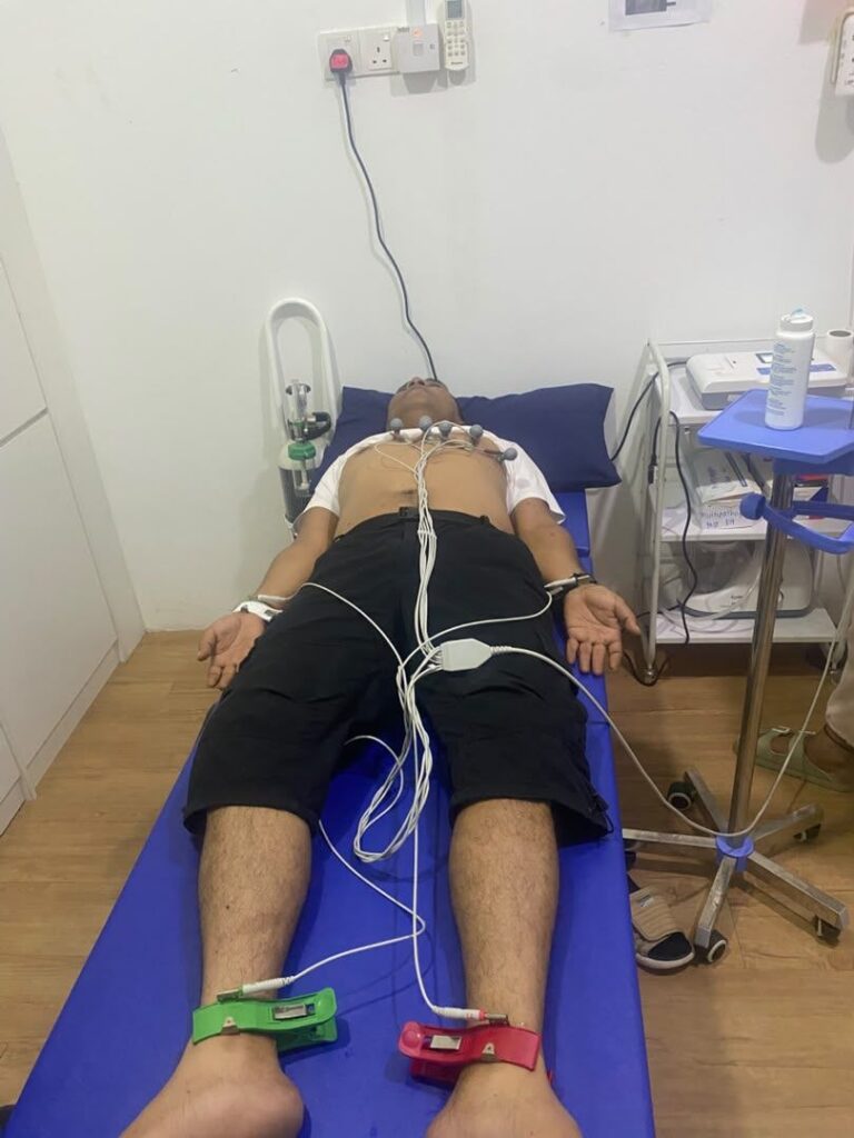 ECG examination being performed on a patient at health screening clinic near Serdang New Village